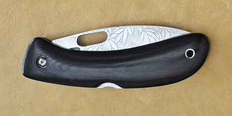 Boye Custom Open Hole Lockback Folding Knife with 'All Over Cannabis Leaf Pattern' Etchings.