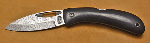 Boye Custom Open Hole Lockback Folding Knife with 'All Over Cannabis Leaf Pattern' Etchings.