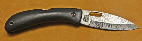 Boye Custom Open Hole Lockback Folding Knife with 'All Over Leaf Pattern' Etchings.