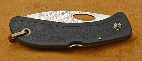 Boye Open Thumb Hole Lockback Folding Pocket Knife with 'Pelican' Etching and Blue Zytel Handle.