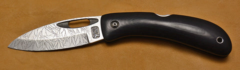 Boye Custom Open Hole Lockback Folding Knife with 'All Over Leaf Pattern' Etchings.