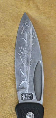 Boye Prophet Lockback Folding Pocket Knife with 'Single Stalk Bamboo' Etching and Black Zytel Handle.