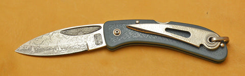 Boye Sunburst Lockback Folding Knife with 'Lighthouse and Sailboats' Etching.