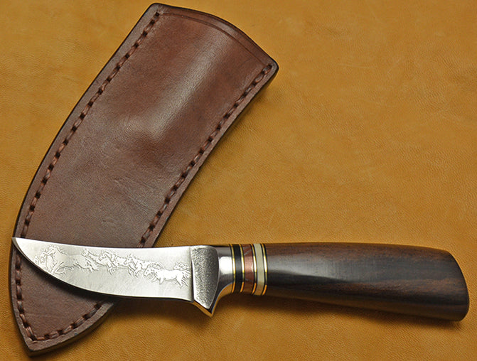 3 inch Trailing Point Skinner with 'Mustangs' Etching and Macassar Ebony Handle.