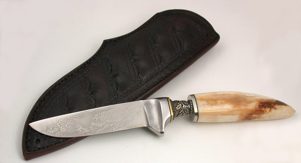 4 inch Dropped Point Hunter with 'Grizzly' Etching.